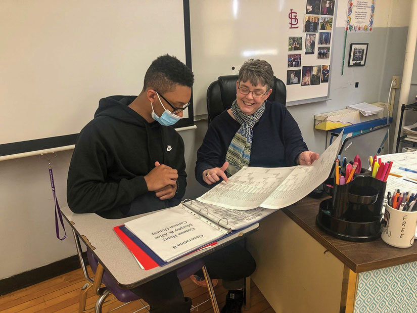 04 17 2022 marquette hs Chris Bams discusses ancestry with teacher
