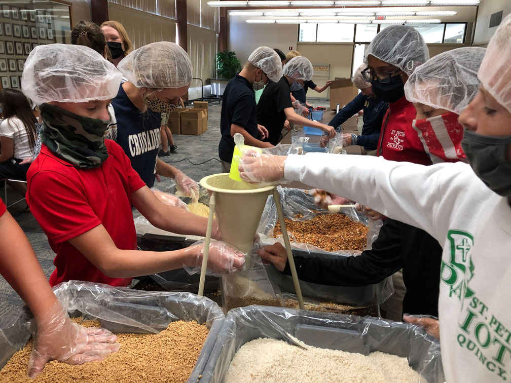 Quincy students pack rice