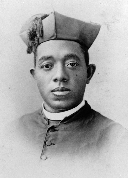 Father Augustine Tolton, also known as Augustus, is pictured in a photo from an undated portrait card. Born into slavery in Missouri, he was ordained a priest April 24, 1886. He served as pastor at St. Joseph Church in Quincy and later established St. Monica’s Church in Chicago. The canonization cause of Father Tolton, the first U.S. diocesan priest of openly African descent, was opened in Chicago earlier in March.
