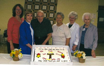 St. Elizabeth Fraternity of the Secular Franciscan Order honored jubilarians during an Aug. 15 Mass and luncheon. Shown here posing with a celebratory cake are (left to right) Julie Regner and Mary Demers (25 years); and Frank Coens, Rita Steinkamp, Inez Neuser, and Marianne Crocker (50 years).
